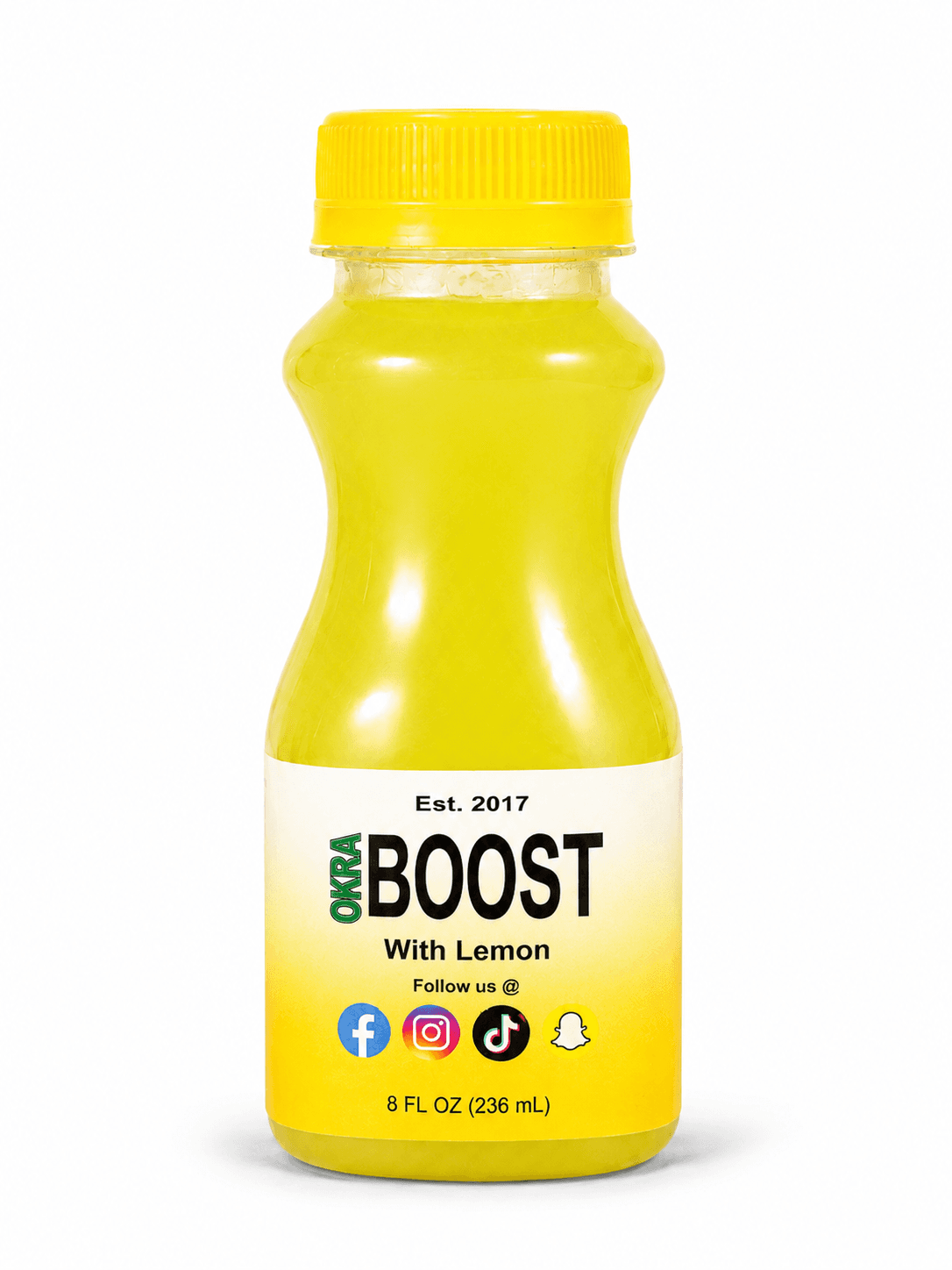Okra Boost Lemon: yellow-cap bottle with bright lemon-yellow liquid, clean white studio backdrop